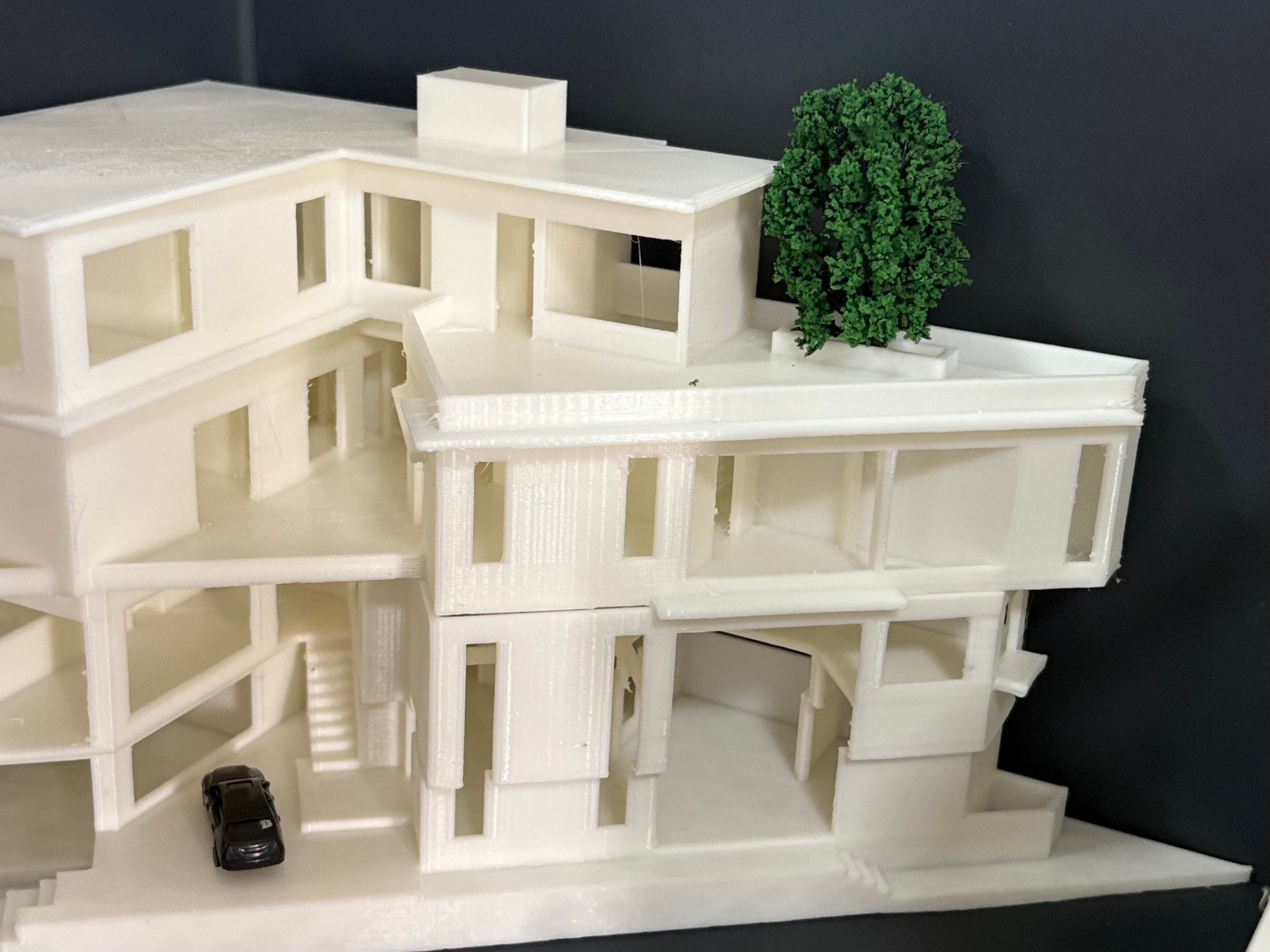 On-site 3D printing process constructing a residential structure with minimal material waste.